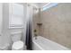 Bright bathroom featuring a shower over tub with modern fixtures at 14800 Hudson St, Thornton, CO 80602