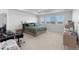 Spacious bedroom with three windows and room for a home office setup at 14800 Hudson St, Thornton, CO 80602