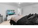 Spacious bedroom featuring a tv, dresser, and soft carpet, perfect for relaxing at 14800 Hudson St, Thornton, CO 80602