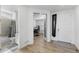 Bright entryway with wood-look floors, a full bath, and access to the office at 14800 Hudson St, Thornton, CO 80602