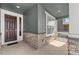 Charming front porch featuring stone accents and a covered entrance at 14800 Hudson St, Thornton, CO 80602