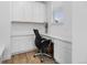 Well-lit office space with built-in desk, cabinets, and a comfortable chair; perfect for working from home at 14800 Hudson St, Thornton, CO 80602