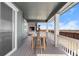 Covered porch with table and chairs, perfect for outdoor dining and entertaining at 14800 Hudson St, Thornton, CO 80602