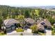 A view of the beautiful neighborhood, surrounded by lush greenery and a golf course, offering a serene setting at 3315 Klondike Pl, Castle Rock, CO 80108