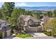 Inviting two-story home with a three-car garage and well-manicured front yard with mountain views at 3315 Klondike Pl, Castle Rock, CO 80108