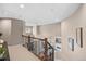 Open foyer with a view of the living area, showcasing elegant railings and neutral colors at 3315 Klondike Pl, Castle Rock, CO 80108