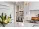 Bright kitchen with an oversized marble island, white cabinets, pendant lighting and stainless appliances at 3315 Klondike Pl, Castle Rock, CO 80108