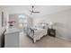 Bright main bedroom with vaulted ceiling, fan, and a large window for natural light at 3315 Klondike Pl, Castle Rock, CO 80108