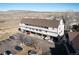 Aerial view of the three-story apartment buildings with covered parking at 4206 S Eldridge St # 309, Morrison, CO 80465