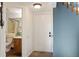 Inviting entryway with tile flooring and a view of a half bathroom at 4206 S Eldridge St # 309, Morrison, CO 80465