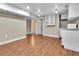 Finished basement area with laminate floors and kitchenette at 13957 E Louisiana Pl, Aurora, CO 80012