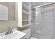 Modern bathroom with tiled shower and white vanity at 13957 E Louisiana Pl, Aurora, CO 80012