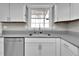 Kitchen with stainless steel sink beneath a bright window at 13957 E Louisiana Pl, Aurora, CO 80012