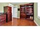 Home office with hardwood floors and custom wood bookcase at 13957 E Louisiana Pl, Aurora, CO 80012