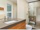 Contemporary bathroom featuring a frameless glass shower and dual sinks at 21 S Kearney St, Denver, CO 80224