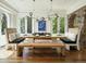 Elegant dining room with a rustic wooden table and bench at 21 S Kearney St, Denver, CO 80224