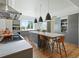 Modern kitchen with stainless steel appliances and large island at 21 S Kearney St, Denver, CO 80224