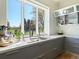 Modern kitchen with a large window offering a park view at 21 S Kearney St, Denver, CO 80224