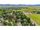 Beautiful aerial view of residential community with mature trees and lush green landscaping at 5971 Windy St, Golden, CO 80403