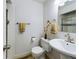 Classic bathroom with a stand alone sink, neutral color scheme, and tiled shower and flooring at 5971 Windy St, Golden, CO 80403