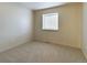 Clean and bright bedroom featuring neutral carpet and a window to let in natural light at 5971 Windy St, Golden, CO 80403