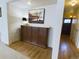 Entry hallway with hardwood flooring, storage cabinets, and decor at 5971 Windy St, Golden, CO 80403