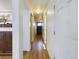 Entry hallway with hardwood flooring, storage cabinets, and decor at 5971 Windy St, Golden, CO 80403