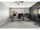 Office space featuring a large window providing natural light and multiple desks and chairs at 8288 W Chestnut Ave, Littleton, CO 80128