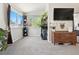 Bedroom includes large windows with an attached living space with wooden furniture at 8288 W Chestnut Ave, Littleton, CO 80128