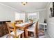Cozy dining room with wood table and seating at 8288 W Chestnut Ave, Littleton, CO 80128