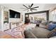 Spacious living room showcasing open layout, stylish rug, modern furnishings, and lots of natural light at 8288 W Chestnut Ave, Littleton, CO 80128