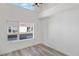 Bright bedroom with hardwood floors, a large window, and neutral walls at 1308 Snowberry Ln # 301, Louisville, CO 80027