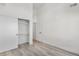 Clean bedroom with hardwood floors, a closet, and neutral walls at 1308 Snowberry Ln # 301, Louisville, CO 80027