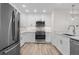 Bright kitchen featuring stainless steel appliances, white cabinets and drawers, light countertops, and hardwood floors at 1308 Snowberry Ln # 301, Louisville, CO 80027