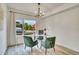 Bright office space with a modern chandelier, large window, and sleek decor at 1308 Snowberry Ln # 301, Louisville, CO 80027