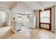 Kitchen and living room featuring white appliances and tile, and hardwood floors at 215 E 11Th Ave # C3, Denver, CO 80203