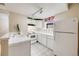 Functional kitchen featuring white appliances, tiled countertops, and ample lighting at 215 E 11Th Ave # C3, Denver, CO 80203