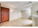 Spacious living room featuring hardwood floors and a classic wood door at 215 E 11Th Ave # C3, Denver, CO 80203