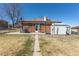 Spacious backyard features a shed, concrete patio and a basketball hoop, perfect for outdoor activities at 10454 Grant Dr, Northglenn, CO 80233