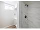 Renovated bathroom showcasing modern tile shower, white vanity, and sleek fixtures at 10454 Grant Dr, Northglenn, CO 80233