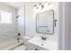 Modern bathroom with white marble tile and sleek fixtures at 10454 Grant Dr, Northglenn, CO 80233