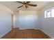 Bedroom with hardwood floors, a closet, and a ceiling fan at 10454 Grant Dr, Northglenn, CO 80233