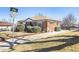 Charming brick home featuring a well-maintained front yard and mature landscaping at 10454 Grant Dr, Northglenn, CO 80233