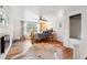 Inviting bedroom with hardwood floors, rustic bed frame, and natural light from large window at 27383 Highway 74, Evergreen, CO 80439