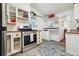 Efficient kitchen with stainless steel oven and stove and vintage farmhouse aesthetic at 27383 Highway 74, Evergreen, CO 80439