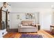 Bright living room with hardwood floors, stylish decor, and comfortable seating creating a relaxing retreat at 27383 Highway 74, Evergreen, CO 80439