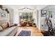 Bright living room with hardwood floors, stylish decor, and comfortable seating creating a relaxing retreat at 27383 Highway 74, Evergreen, CO 80439
