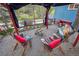 Relaxing outdoor seating area with a custom pergola, rustic furniture, and mountain views at 27383 Highway 74, Evergreen, CO 80439