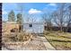 Backyard featuring a storage shed, fence, and walkway at 343 Melody Dr, Northglenn, CO 80260