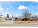 Single-Gathering home with a brick facade, a two-car garage, and a well-maintained lawn at 343 Melody Dr, Northglenn, CO 80260